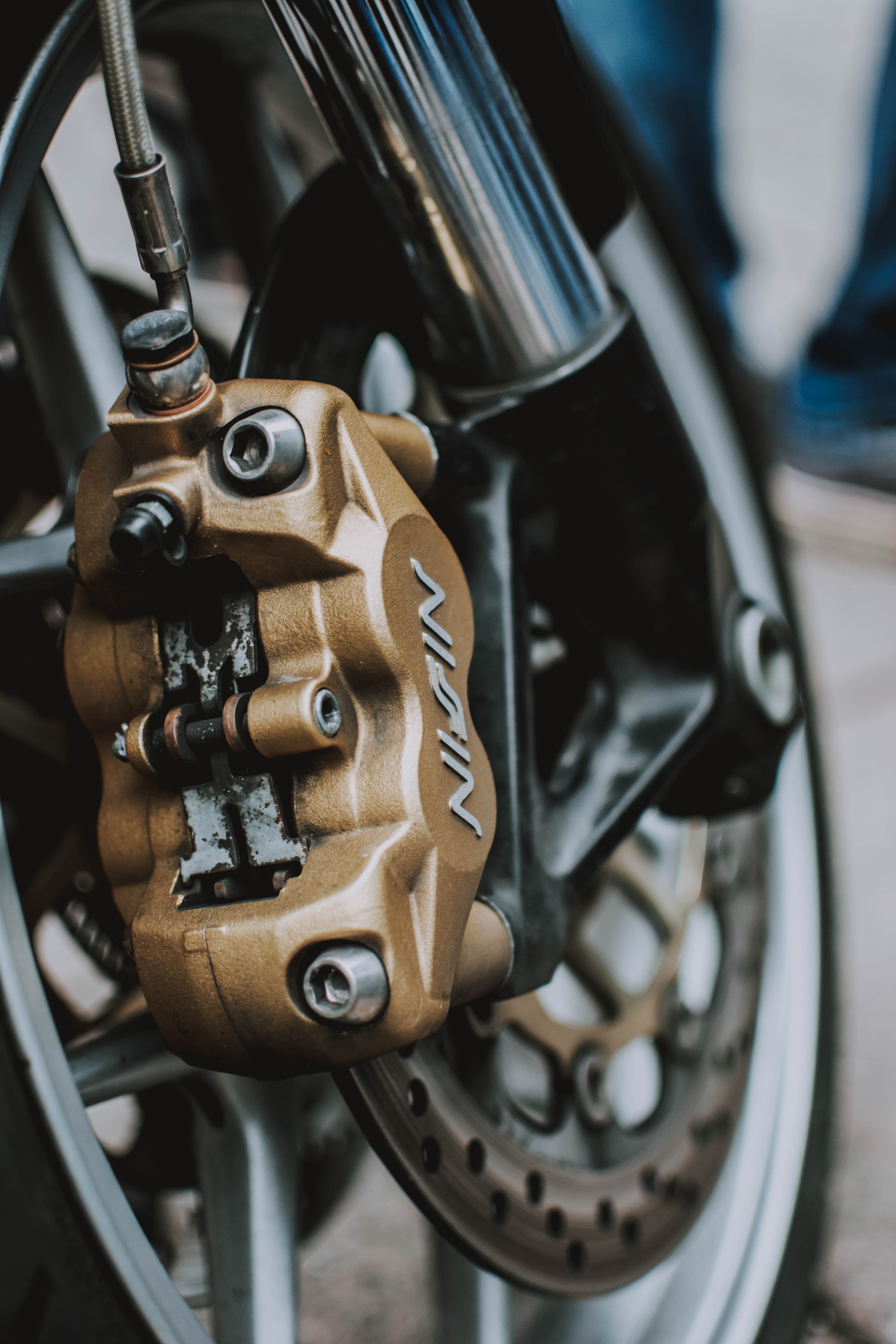 What is the safest braking method on a motorcycle?